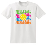 White t-shirt with colorful 'Pickleball' text and pickleball ball graphic on a white background